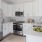 Kitchen with white cabinets, stainless steel appliances, and granite countertops