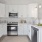 Kitchen with white cabinets, stainless steel appliances, and granite countertops