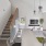 Open concept living area with stairwell leading upstairs, large kitchen, and spacious living room