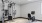 bright fitness room with weight and cardio equipment
